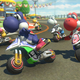a bunch of yoshis driving motorcycles in mario kart 8 deluxe on the nintendo switch